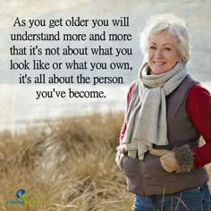 an older woman standing in the grass with a scarf around her neck and a quote on it that says, as you get older you will understand more