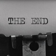 an old fashioned typewriter with the word the end printed on it's paper