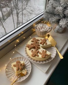 there are two desserts on the windowsill, one is decorated with gingerbread