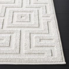 a white rug with squares on it