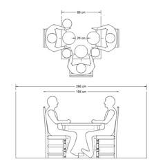 a table with four people sitting at it and one person standing in front of the table