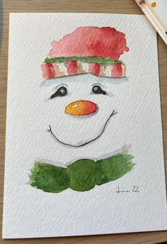 a watercolor drawing of a snowman wearing a red hat and green bow tie