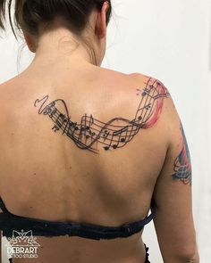 a woman with musical notes on her back