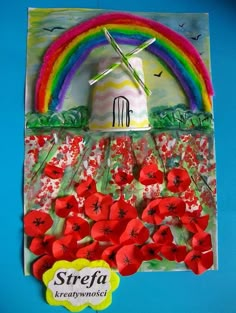 a paper collage with red flowers and a rainbow in the background that says strefa