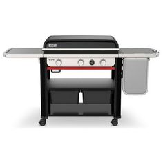 a black and white barbecue grill with two drawers on the top, and one drawer open