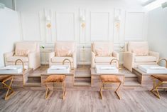 a living room filled with lots of white furniture