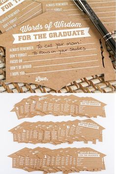 some brown paper tags are sitting on top of each other, with the words for graduation written