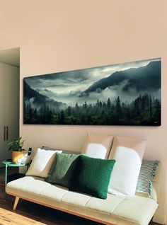 a living room with a couch and painting on the wall