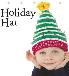 a young child wearing a knitted holiday hat