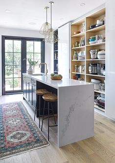 the kitchen is clean and ready to be used as a dining room or living room