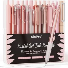 pink and white pens are in a clear box with black writing on the bottom one side