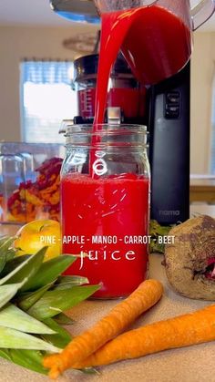 the juice is being poured into a jar