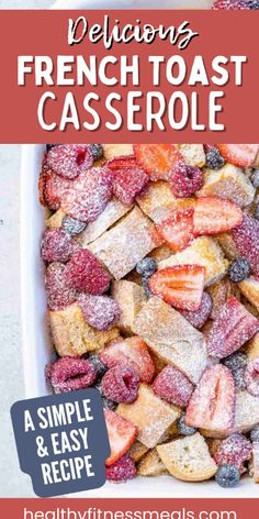 french toast casserole with strawberries and powdered sugar in a white dish