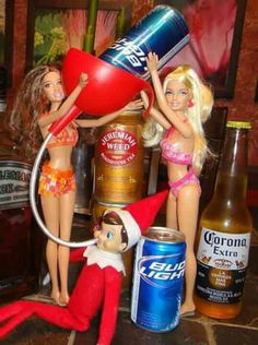 the elf on the shelf is holding a beer and two dolls are standing next to each other