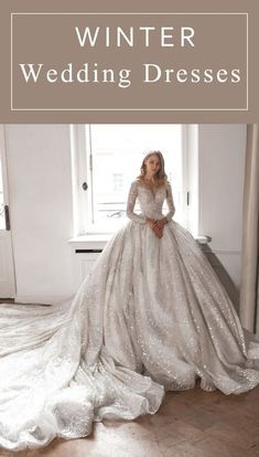 a woman in a wedding dress is standing by a window with the words winter wedding dresses on it