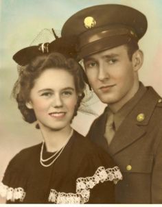 an old photo of a man and woman in uniform