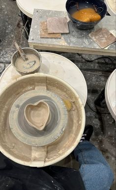 the pottery is being worked on by someone