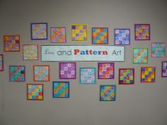 there is a sign that says smile and pattern art on the wall with many squares