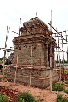 an old brick building with scaffolding around it