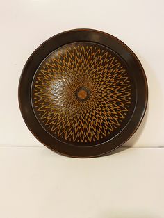 a brown plate sitting on top of a white counter