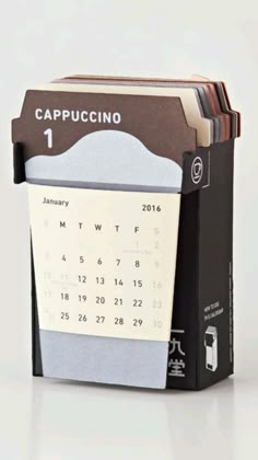 a desk calendar sitting on top of a table