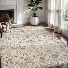 a living room area with a fireplace, chair and rug