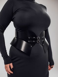 The model is wearing a size XL and is 33.5"/85 cm waist, 35"/89 cm underbust.Stand out from the crowd with this stunning Wasp Corset Belt. Its versatile design allows you to wear the buckles facing back or front, creating a bold and edgy look that's perfect for any occasion. The Wasp design hugs your torso to sculpt a dramatic hourglass waistline. Black Gothic Corset Belt For Night Out, Elegant Black Corset With Belt, Elegant Underbust Corset Belt For Cosplay, Black Party Corset With Belt, Edgy Black Belt For Night Out, Black Corset Belt For Night Out, Elegant Underbust Corset With Belt, Elegant Fitted Corset Belt For Club, Elegant Fitted Corset With Belt