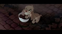 an animated image of a dog on a cobblestone road with the caption lady and the tramp