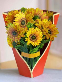 a bouquet of sunflowers in a red vase