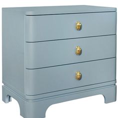 a blue chest of drawers with gold knobs on the top and bottom, against a white background