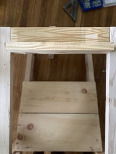 a wooden shelf with some wood on top of it