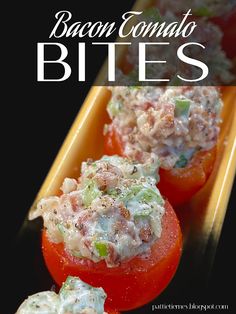 bacon tomato bites with cheese and tomatoes in them on a yellow serving platter next to a black background