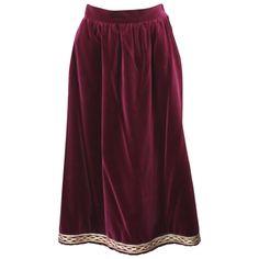 Yves Saint Laurent Russian Collection Skirt in a soft, silky wine cotton/rayon blend. Simply constructed with gathered waist and gold soutache embroidery along hem. Fully lined. YSL Rive Gauche. Side zip closure with 2 pockets. Waist 28", Hip 44", Length 31". Vintage Size 42. Soft 70/30 cotton/rayon blend. Ysl Rive Gauche, Soutache Embroidery, Witchy Outfits, Russian Clothing, Midsize Outfits, Fantasy Wardrobe, Russian Fashion, Velvet Skirt, Rive Gauche