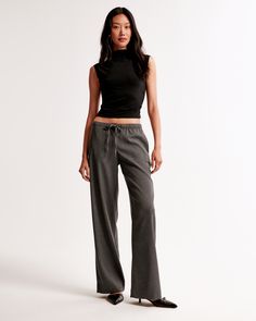 Mid rise, wide leg pants in our everyday menswear fabric, featuring functional pockets and a pull-on style elasticated waistband with a drawstring detail for comfort and adjustability. The body of this garment contains 66% recycled polyester. Menswear Women, Womens Wide Leg Pants, Pull On Pants, New Arrival Dress, Swimwear Accessories, American Apparel, Jacket Tops, Bottoms Pants, Abercrombie Fitch