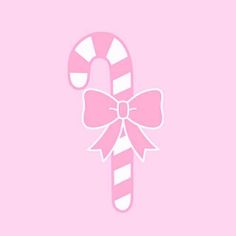 a pink candy cane with a bow on it's side, against a light pink background