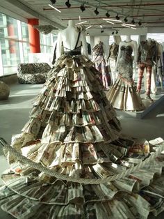 a dress made out of newspapers is on display