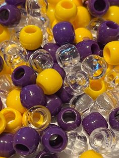 yellow and purple plastic beads are on display