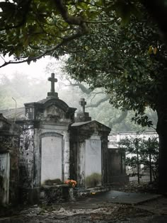 an old cemetery with tombstones and crosses