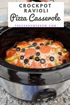 the crockpot ravioli pizza casserole is ready to be cooked in the slow cooker