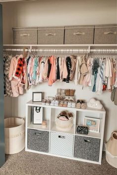 a closet filled with lots of baby clothes