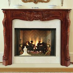 an ornate fireplace with two people sitting on it