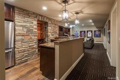 a kitchen and living room are shown in this house's new model home, which is currently on the market for $ 1 million