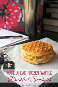 a waffle sandwich sitting on top of a piece of paper