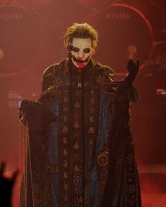 a man dressed as the joker on stage