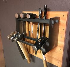 there are many tools hanging on the wall