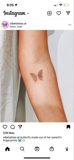 a woman's arm with a small butterfly tattoo on the left side of her arm