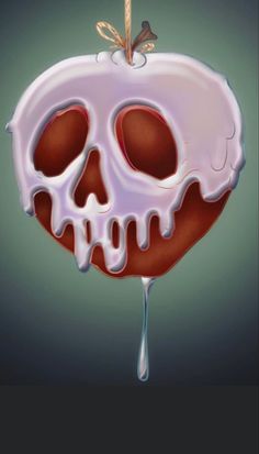 an apple with white icing and a skull on the top is hanging from a string