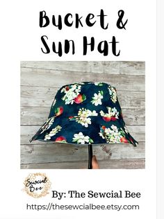 the bucket and sun hat sewing pattern is shown in black with white flowers on it