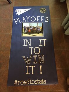 a sign on the floor that says play offs in it to win it roadstate