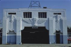 an old building with art deco design on the front